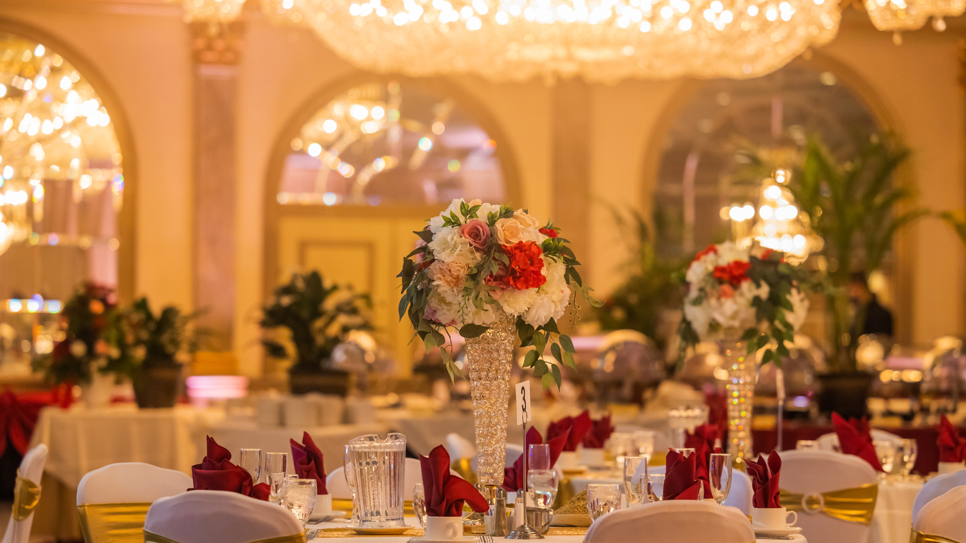 Event decorations featuring tall Centerpieces with florals.