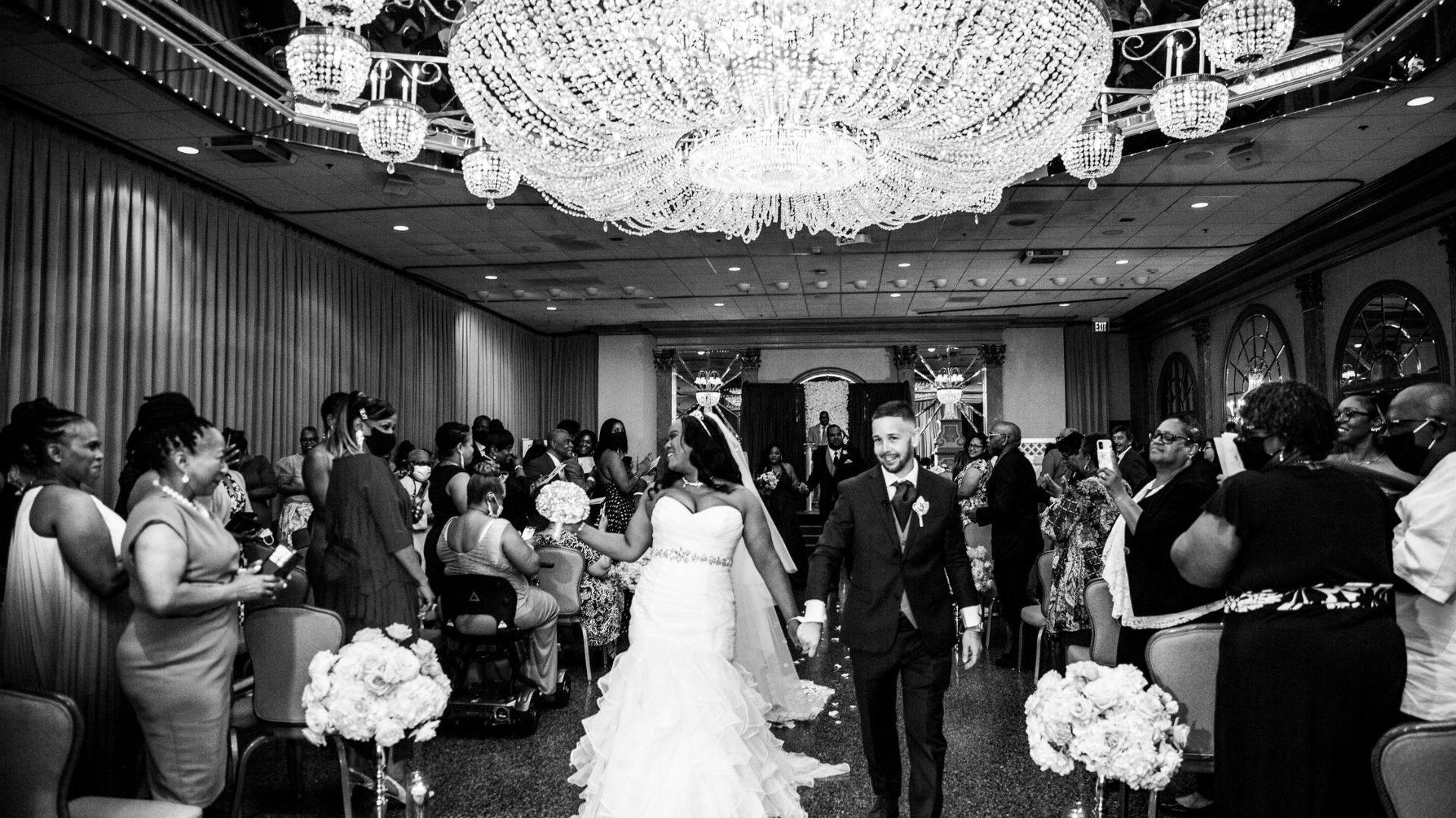 Just married bride and groom leaving their ceremony,